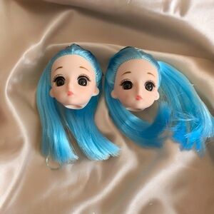 Sad eye baby doll heads blue hair pigtails face fish hook pierced earrings